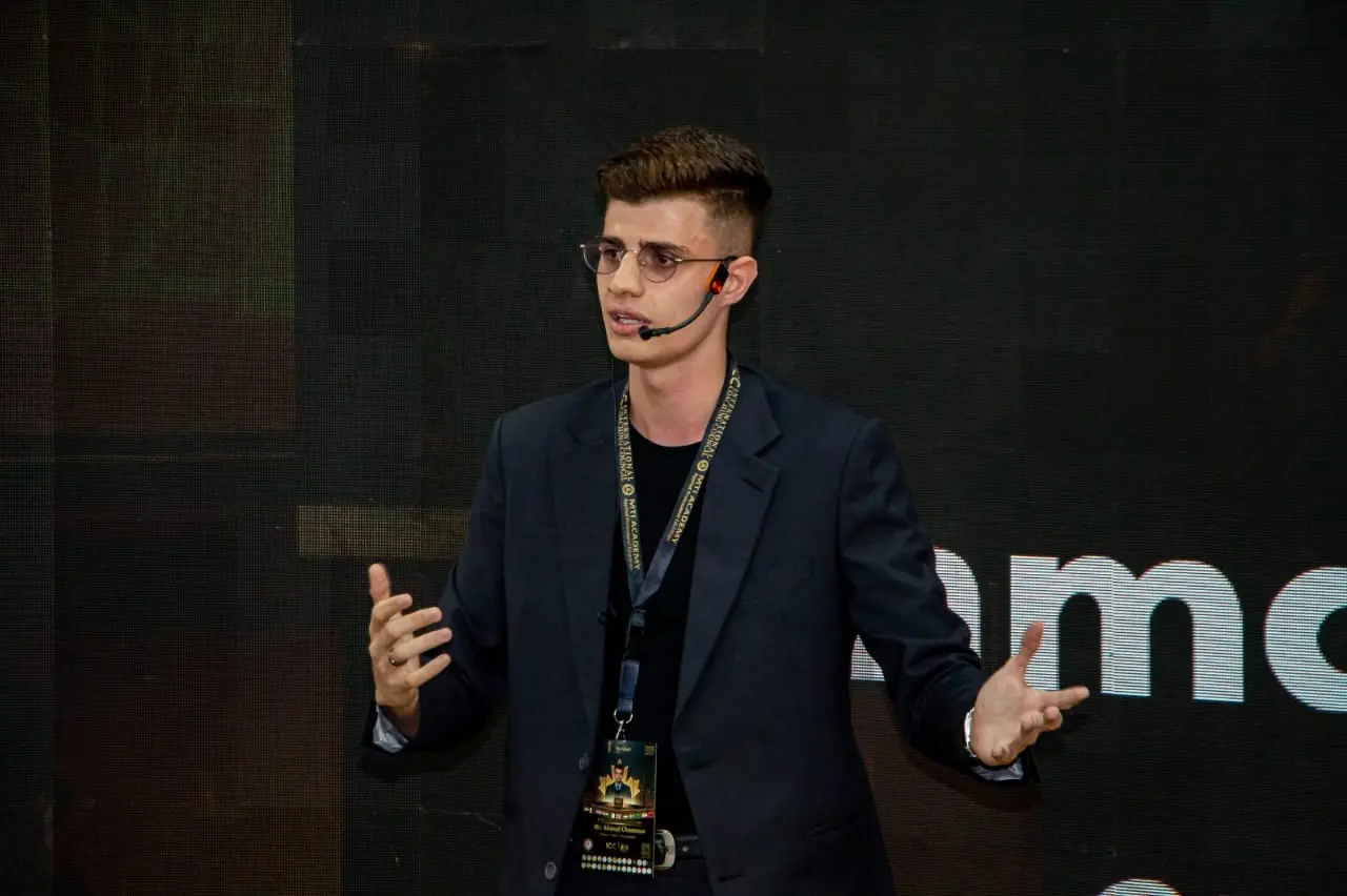 Ahmad Chammas speaking on stage